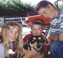 Picture of three children and a dog